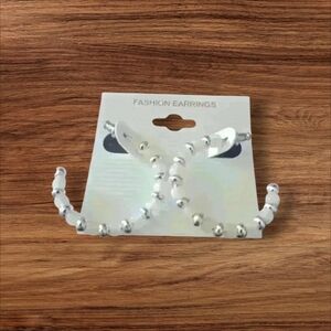 Silver and white beaded hoop earrings